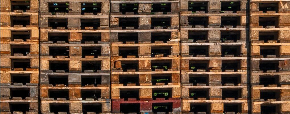 a-large-stack-of-wooden-pallets